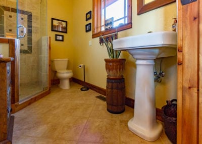Bathroom renovation with glass shower and custom tile work